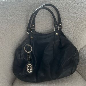 Gucci Black Shoulder Bag with Gold Accents